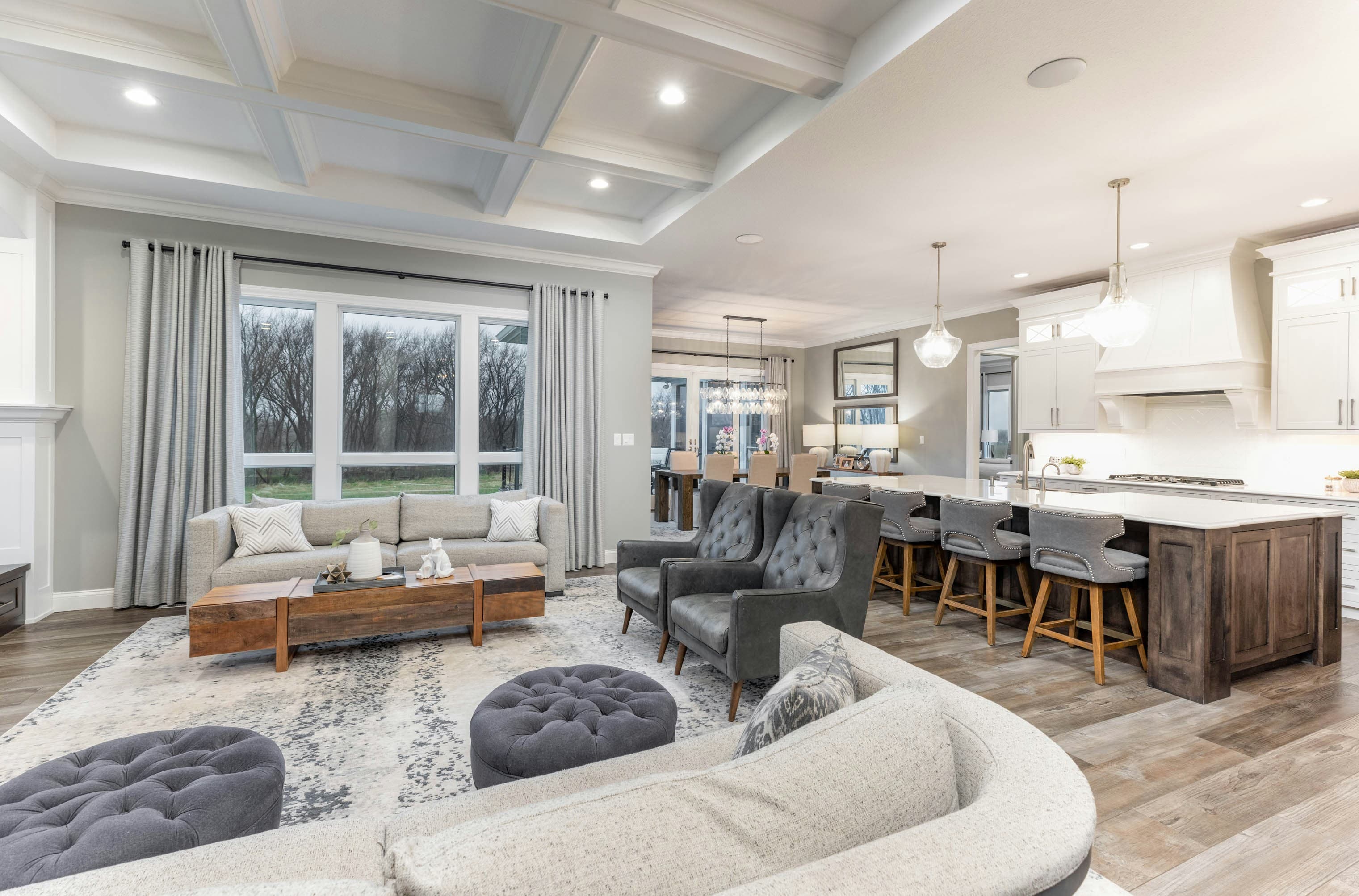 Luxury open-concept living room with coffered ceiling